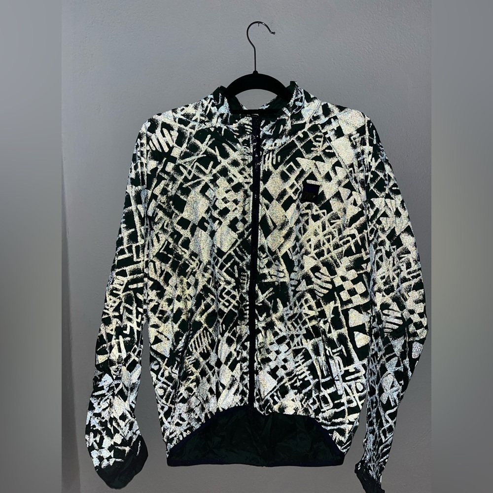Vintage , reflective light jacket. (Glows with light reflection).
